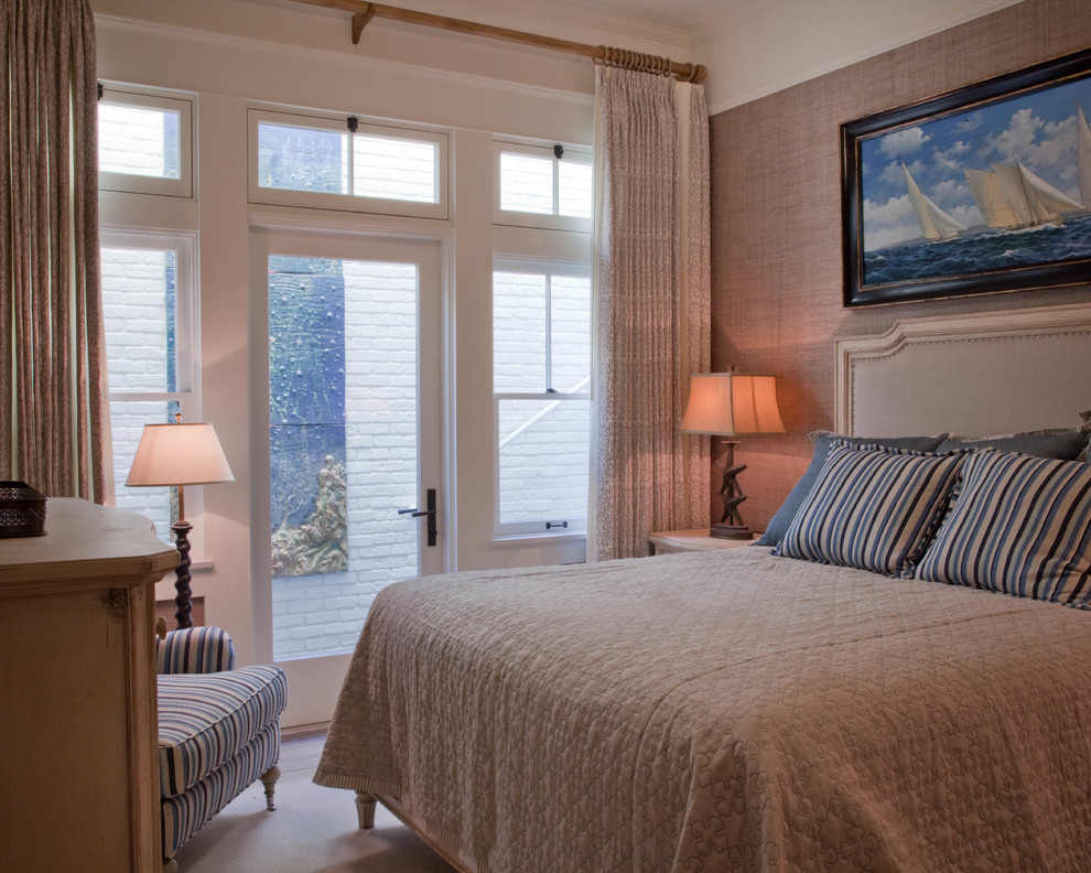 This is an example of a mid-sized beach style master bedroom in San Diego with medium hardwood floors and brown walls.