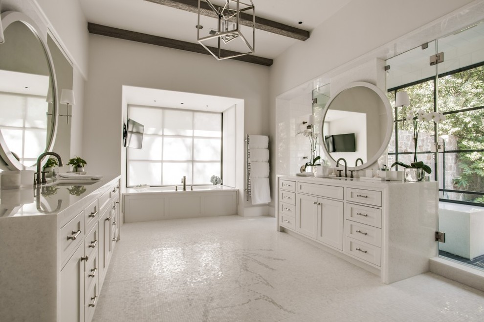 Expansive transitional master bathroom in Dallas with shaker cabinets, white cabinets, white tile, white walls, mosaic tile floors, an undermount sink, marble benchtops, a drop-in tub, mosaic tile and a double shower.
