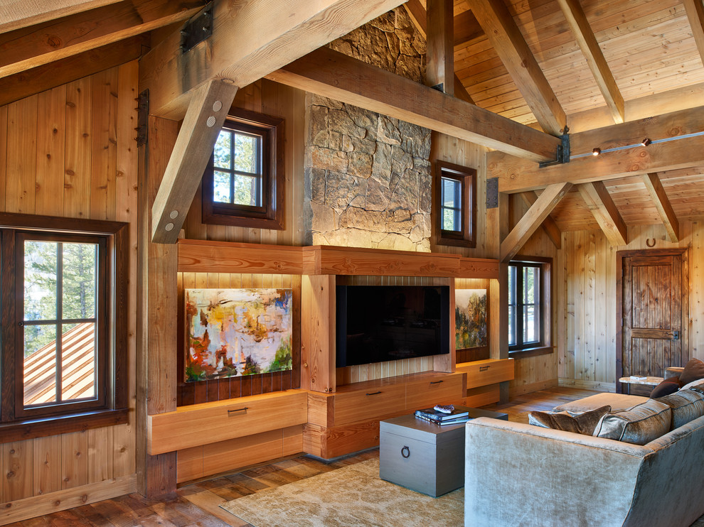 Photo of a country family room in Denver with medium hardwood floors and a built-in media wall.
