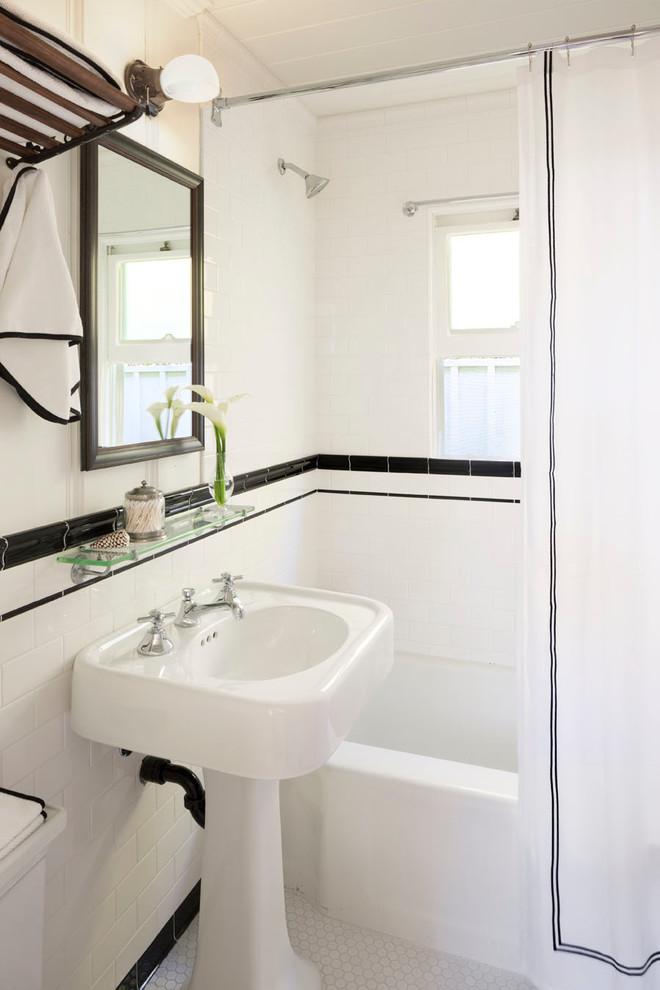 Bathroom - small victorian white tile bathroom idea in Orange County with a pedestal sink and white walls
