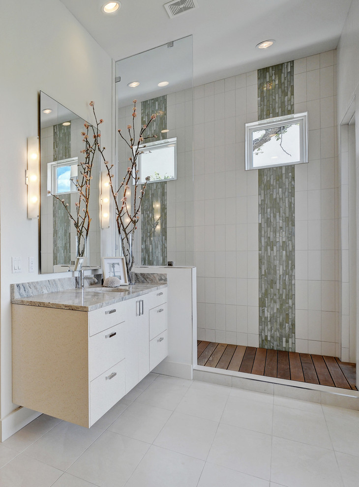 Inspiration for a mid-sized contemporary master bathroom in Austin with an undermount sink, flat-panel cabinets, white cabinets, quartzite benchtops, an open shower, green tile, glass tile, white walls, porcelain floors and an open shower.