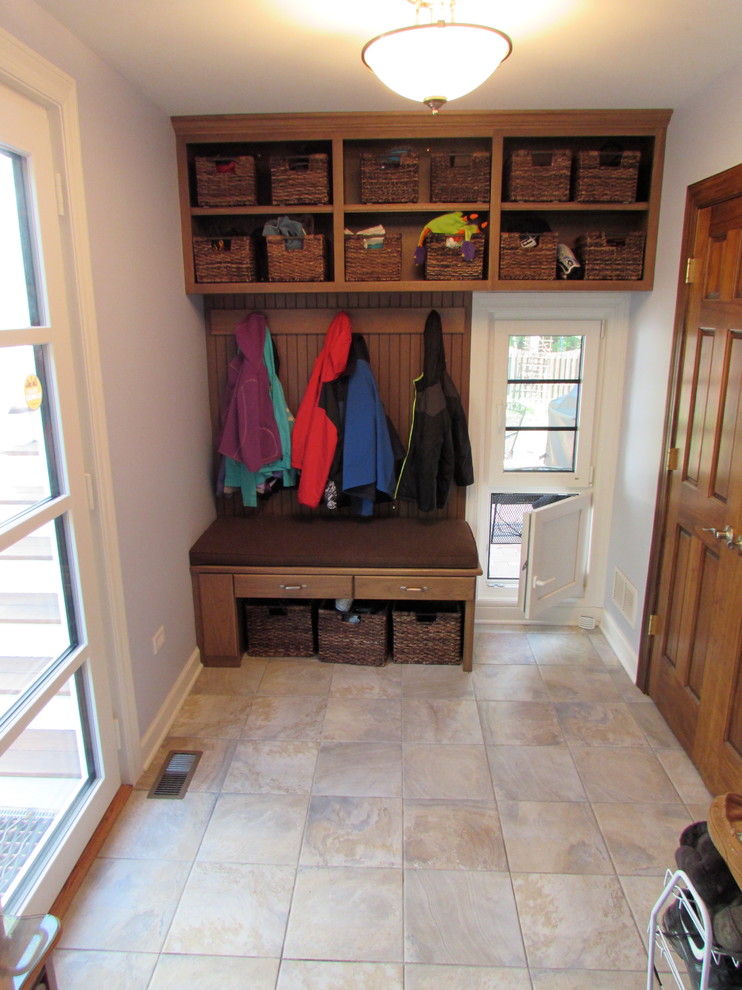 Mid-sized transitional ceramic tile and beige floor mudroom photo in Chicago with purple walls and a glass front door