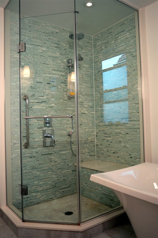Small master bathroom in Toronto with a corner shower, multi-coloured tile and mosaic tile.