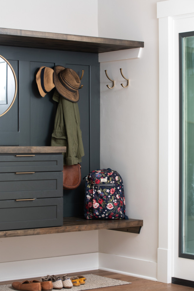 Entryway - transitional medium tone wood floor and brown floor entryway idea with white walls