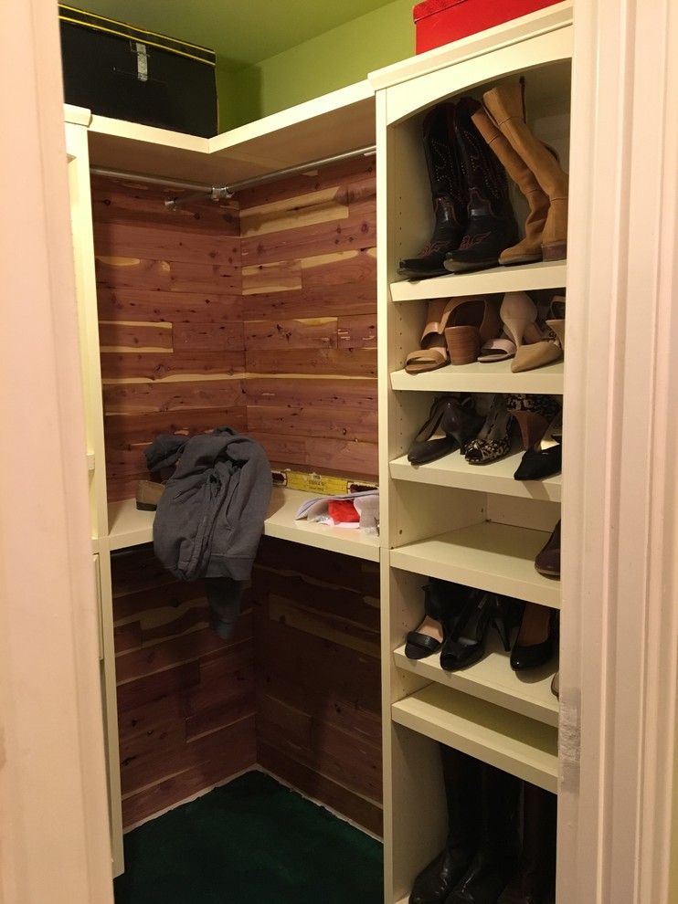 Inspiration for a mid-sized country women's walk-in wardrobe in Los Angeles with raised-panel cabinets, white cabinets, multi-coloured floor and carpet.