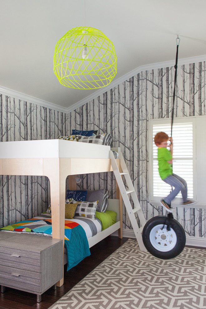 This is an example of a transitional kids' bedroom for kids 4-10 years old and boys in Los Angeles with dark hardwood floors.