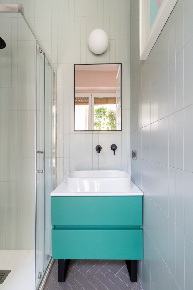 Photo of a small modern 3/4 bathroom in Milan with flat-panel cabinets, green cabinets, a corner shower, a wall-mount toilet, green tile, ceramic tile, pink walls, porcelain floors, a vessel sink, laminate benchtops, grey floor, a sliding shower screen, white benchtops, a niche, a single vanity, a freestanding vanity and panelled walls.
