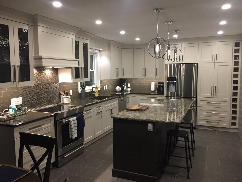 Inspiration for a mid-sized transitional l-shaped ceramic tile and gray floor eat-in kitchen remodel with an undermount sink, shaker cabinets, white cabinets, quartz countertops, brown backsplash, mosaic tile backsplash, stainless steel appliances and an island