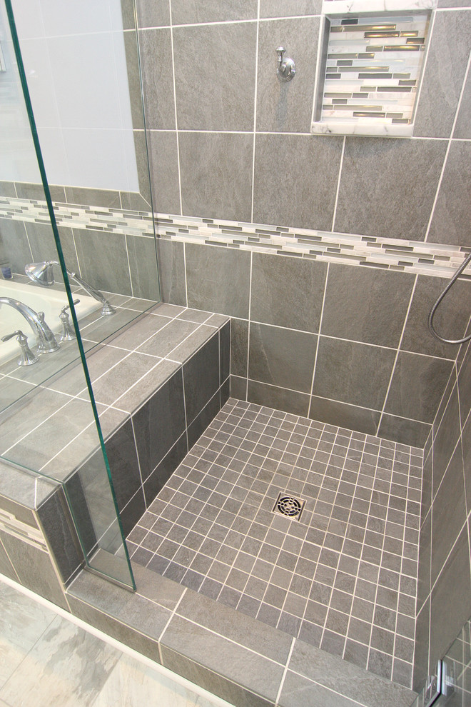 Example of a mid-sized transitional master gray tile and porcelain tile linoleum floor home design design with an undermount sink, raised-panel cabinets, white cabinets, marble countertops, a two-piece toilet and purple walls