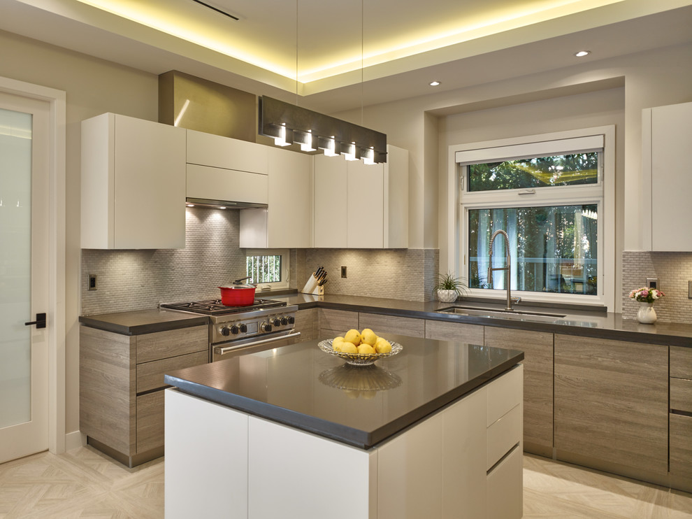 Photo of a mid-sized contemporary u-shaped eat-in kitchen in Vancouver with an undermount sink, flat-panel cabinets, light wood cabinets, granite benchtops, grey splashback, stone tile splashback, stainless steel appliances, porcelain floors and with island.