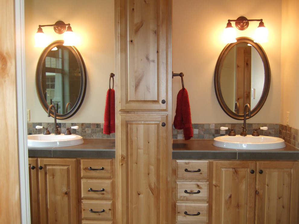 Photo of a rural ensuite bathroom in Portland with raised-panel cabinets, light wood cabinets, a claw-foot bath, a double shower, a one-piece toilet, multi-coloured tiles, slate tiles, slate flooring, a built-in sink, tiled worktops, multi-coloured floors, a hinged door, green worktops, double sinks and a built in vanity unit.