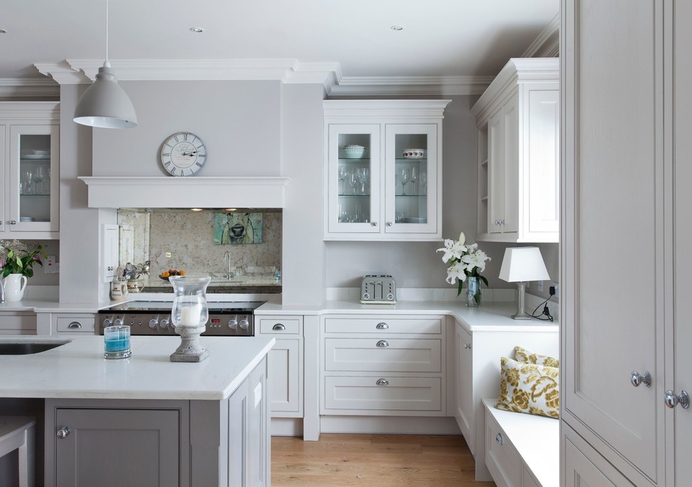 Photo of a country kitchen in Other with mirror splashback.