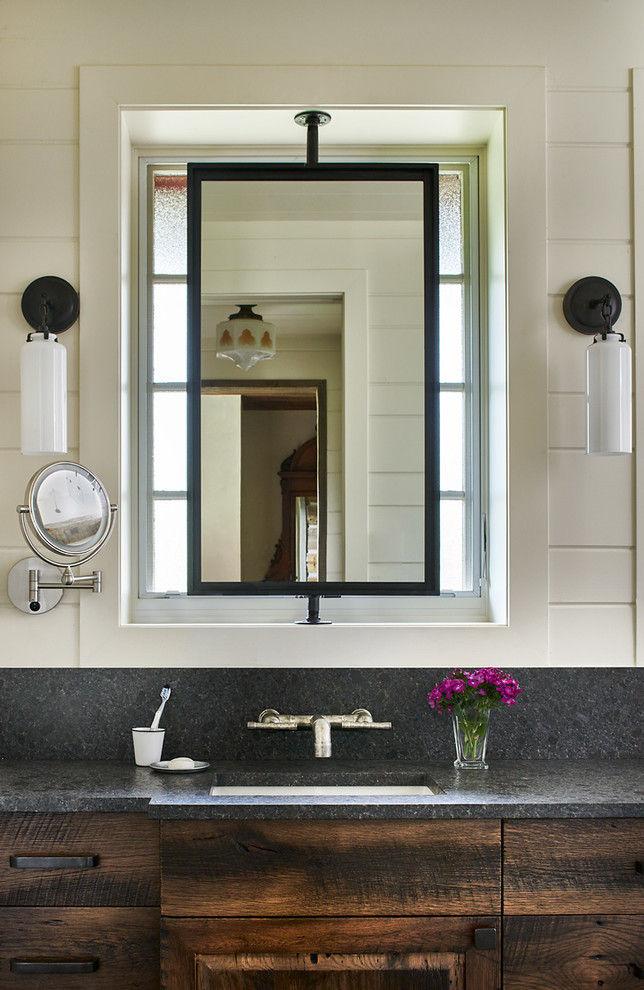 Inspiration for an eclectic master bathroom in Denver with furniture-like cabinets, dark wood cabinets, a freestanding tub, an alcove shower, white tile, white walls, ceramic floors, an undermount sink, quartzite benchtops, black floor and a hinged shower door.