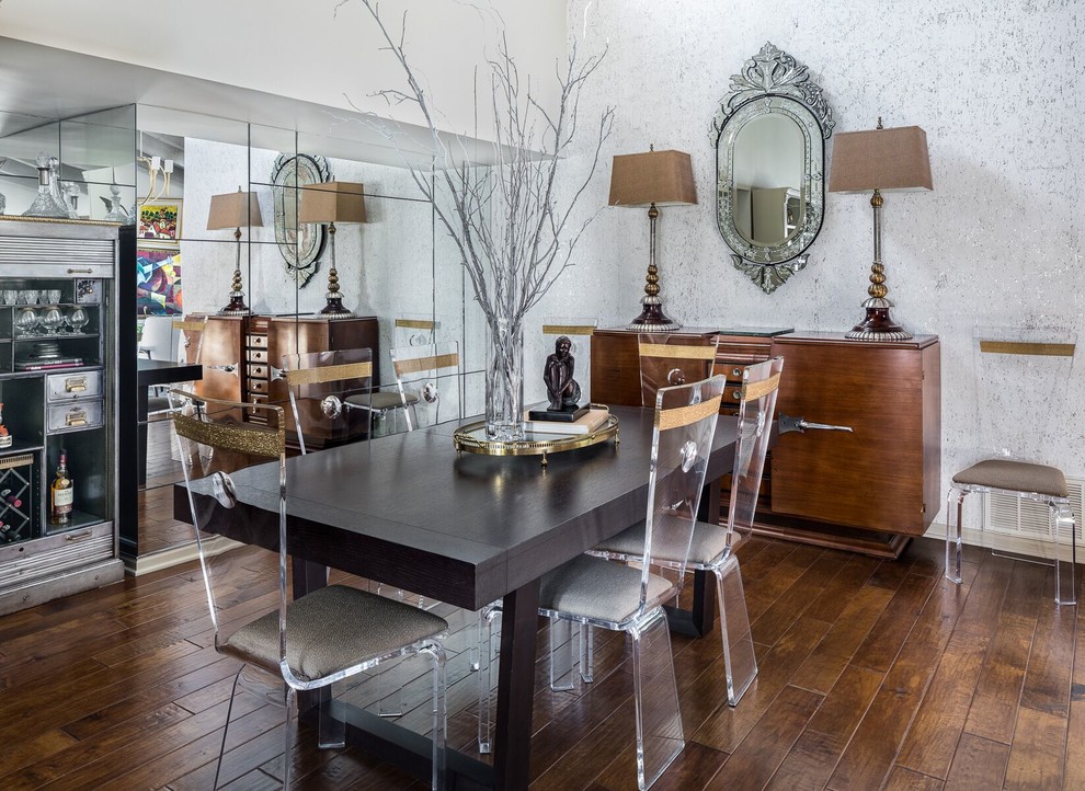 This is an example of an eclectic dining room in Phoenix with white walls, dark hardwood floors and brown floor.