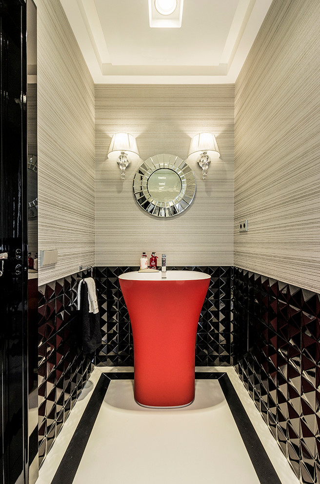 Mid-sized contemporary powder room in Madrid with black tile, a pedestal sink and multi-coloured walls.