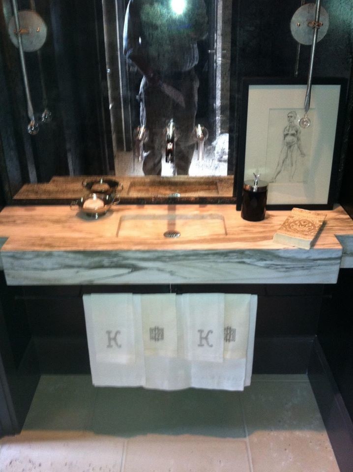 Inspiration for a small transitional 3/4 stone slab bathroom remodel with an integrated sink and marble countertops