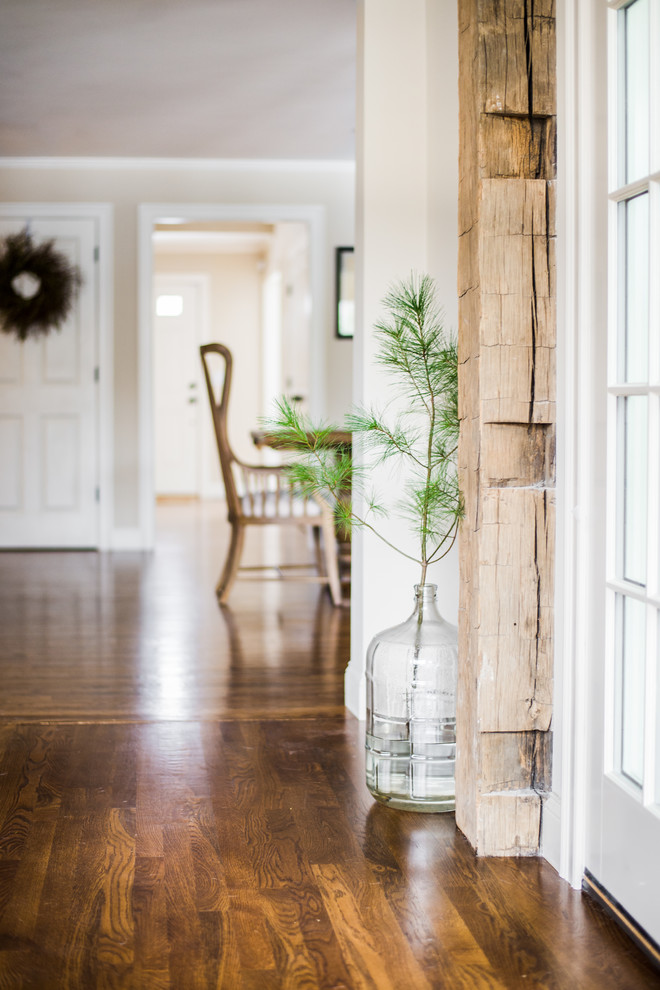 Entryway - transitional medium tone wood floor entryway idea in Boston