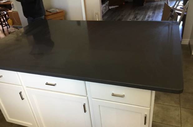 Small transitional kitchen photo with granite countertops, stainless steel appliances and gray countertops