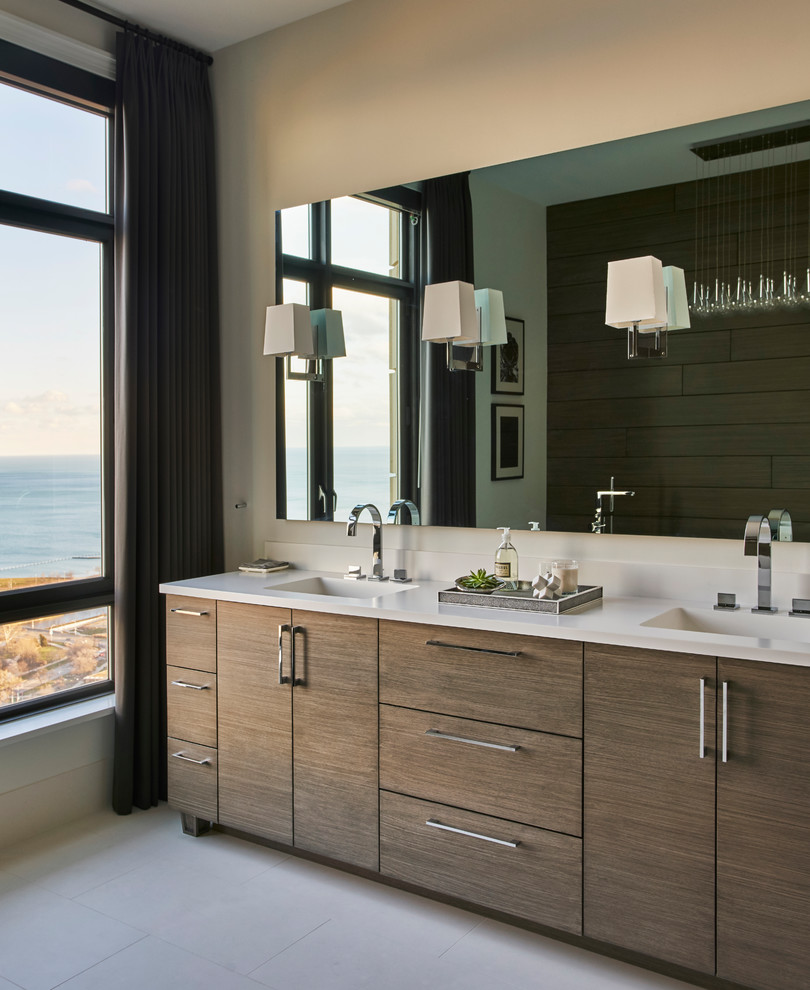Design ideas for a mid-sized modern master bathroom with flat-panel cabinets, dark wood cabinets, beige walls, ceramic floors, an integrated sink, solid surface benchtops and grey floor.