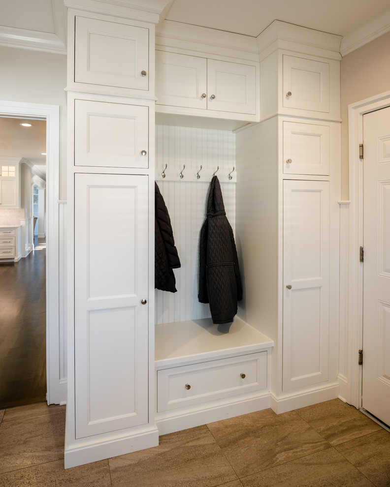 Photo of a mid-sized arts and crafts mudroom in Philadelphia with beige walls, a single front door and a white front door.