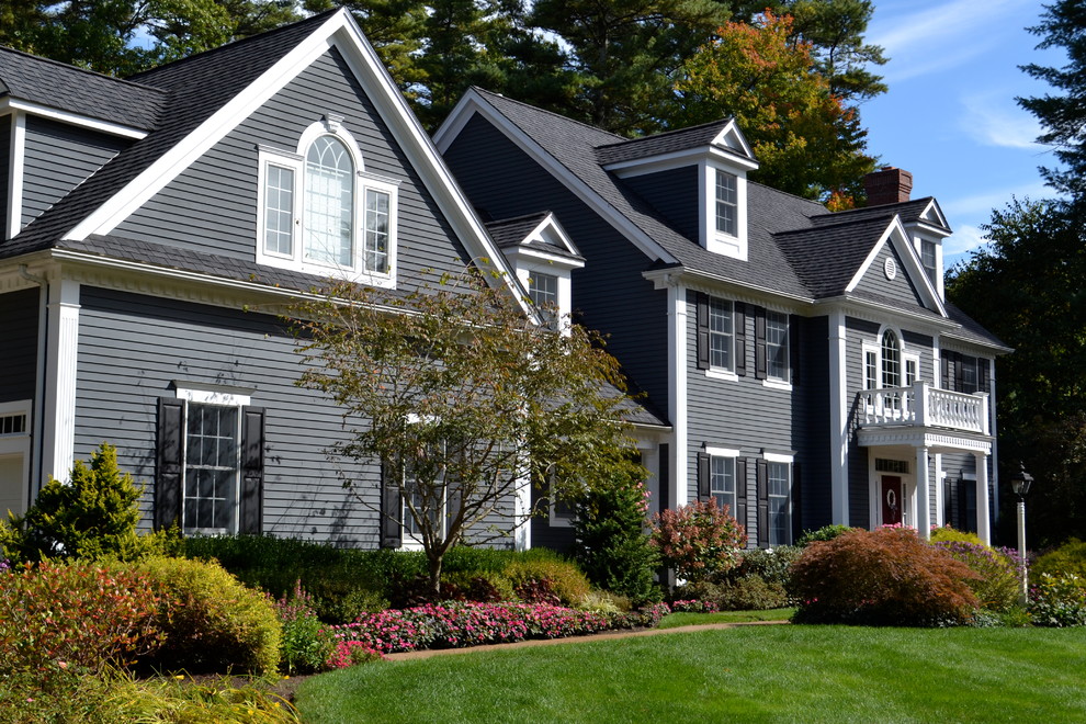 Large elegant gray two-story wood gable roof photo in Boston with a shingle roof