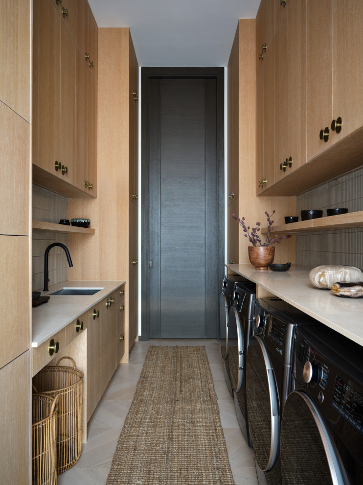 Example of a trendy laundry room design in Austin