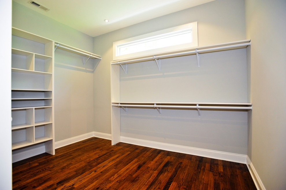 Mid-sized transitional gender-neutral dressing room in Nashville with open cabinets.