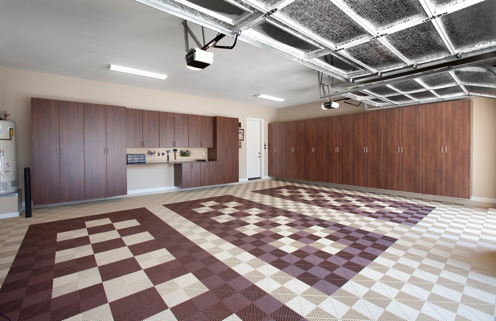 Inspiration for a large contemporary three-car garage remodel in Charleston