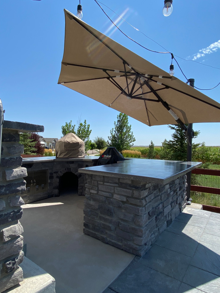 Rustic Reverie: Custom Concrete and Stone Unite in Your Outdoor Culinary Haven