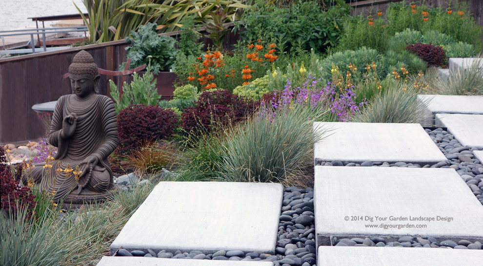 Expansive modern sloped full sun xeriscape in San Francisco with concrete pavers for spring.