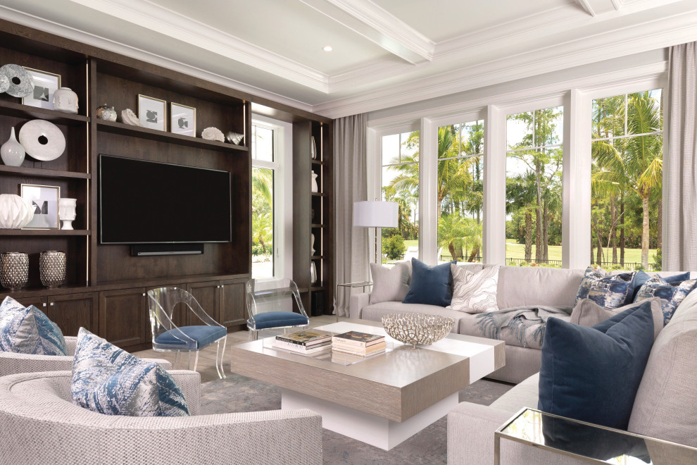 Photo of a mediterranean family room in Miami with a built-in media wall.