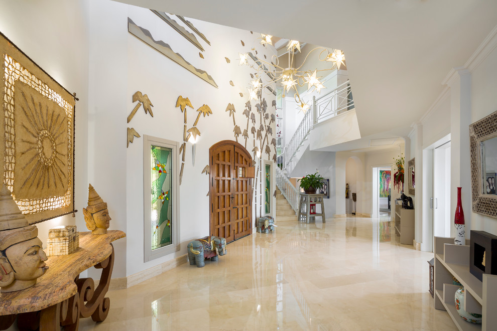 Inspiration for an expansive eclectic foyer in Other with white walls, a double front door and a medium wood front door.
