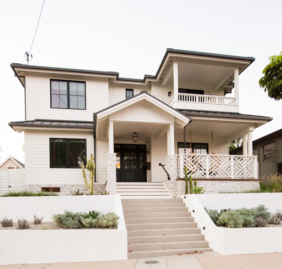 Photo of a beach style home design in San Diego.