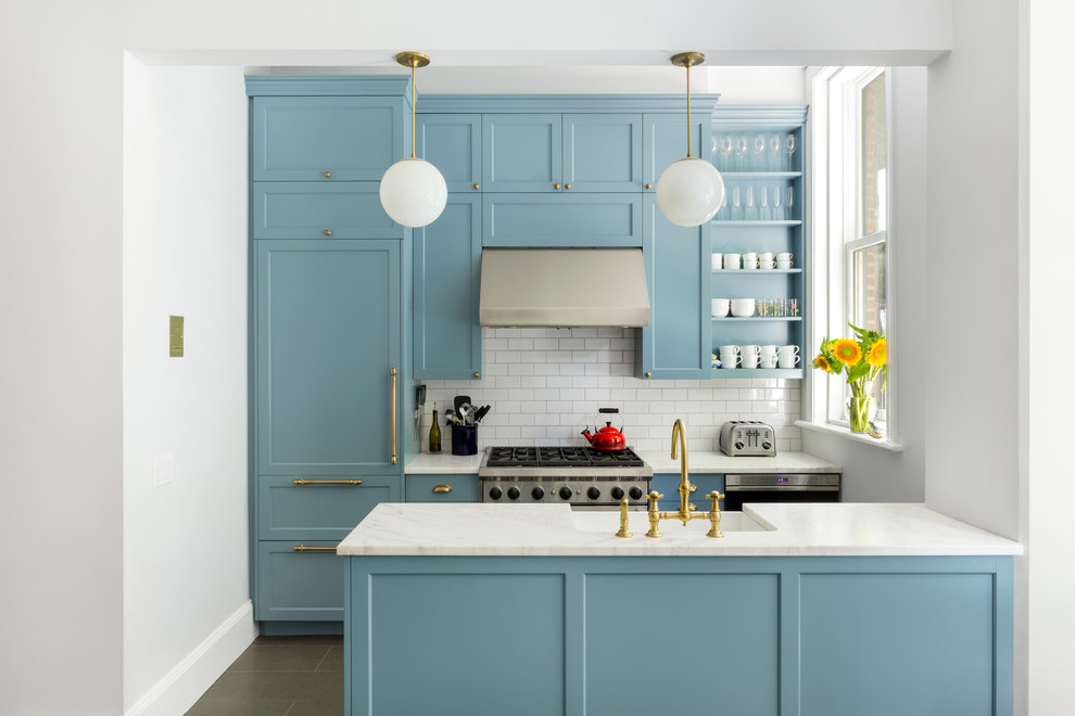 Kitchen photo in New York with an island