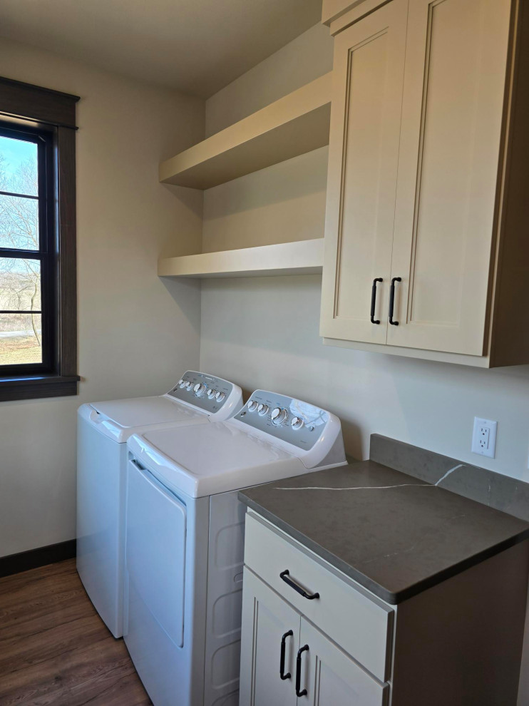 Mid-sized transitional brown floor laundry room photo with gray countertops