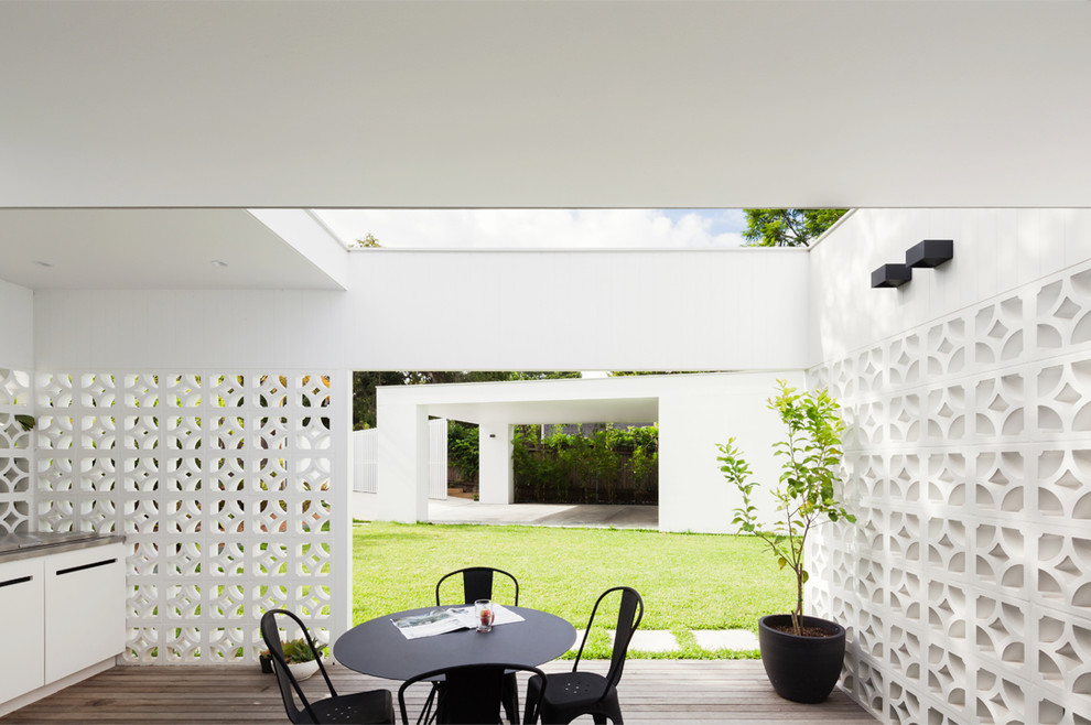 This is an example of a mid-sized contemporary backyard partial sun garden for summer in Sydney.
