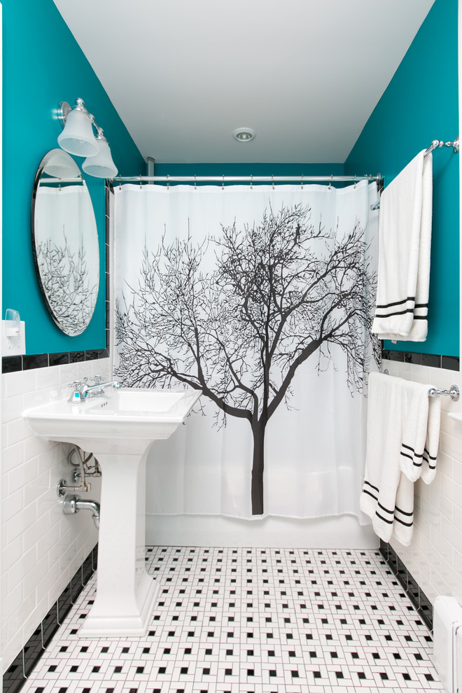 This is an example of a traditional 3/4 bathroom in DC Metro with an alcove tub, a shower/bathtub combo, black and white tile, subway tile, blue walls, mosaic tile floors, a pedestal sink, multi-coloured floor and a shower curtain.