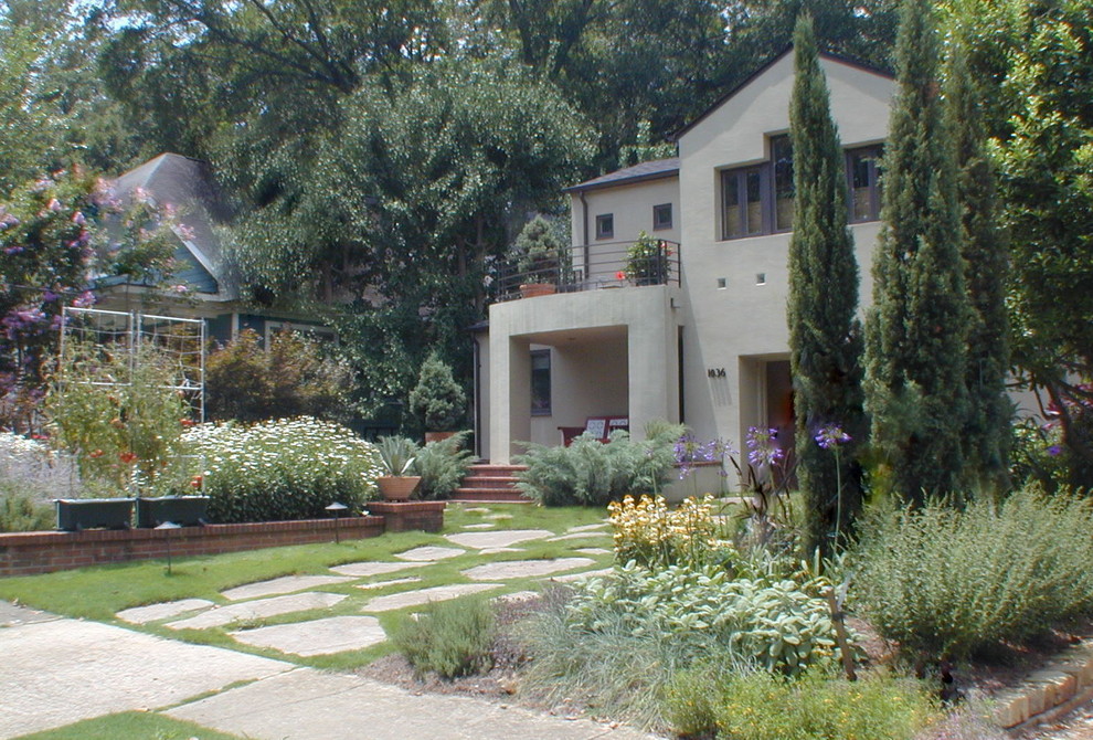 Design ideas for a small modern front yard full sun formal garden for summer in Atlanta with a vegetable garden and natural stone pavers.
