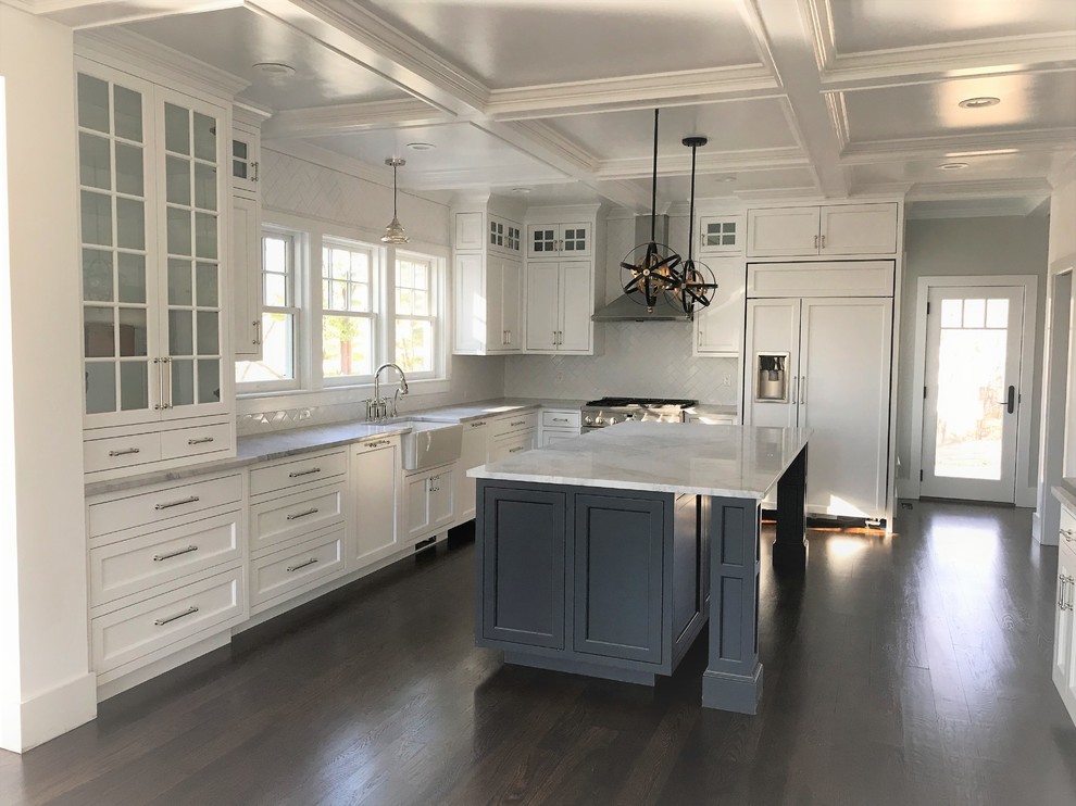 Inspiration for a transitional dark wood floor eat-in kitchen remodel in Bridgeport with shaker cabinets, white cabinets, quartzite countertops, white backsplash, subway tile backsplash, stainless steel appliances, an island and gray countertops