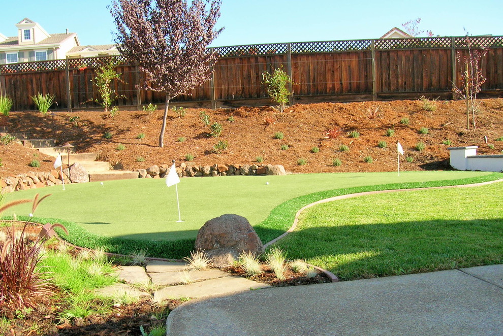 Photo of a large traditional backyard xeriscape in San Francisco with concrete pavers.