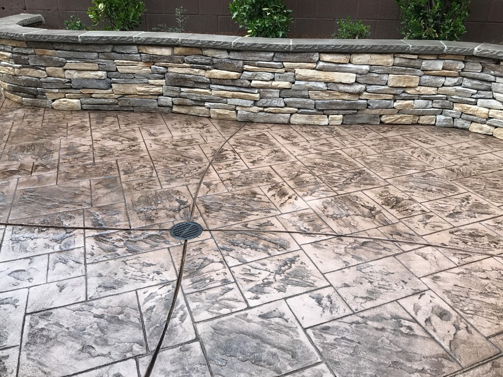 Mid-sized transitional backyard stamped concrete patio photo with no cover