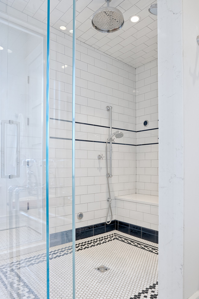 This is an example of a mid-sized traditional master bathroom in Detroit with shaker cabinets, white cabinets, a freestanding tub, an alcove shower, a bidet, white tile, subway tile, white walls, ceramic floors, an undermount sink, marble benchtops, white floor, a hinged shower door, white benchtops, an enclosed toilet, a double vanity and a built-in vanity.