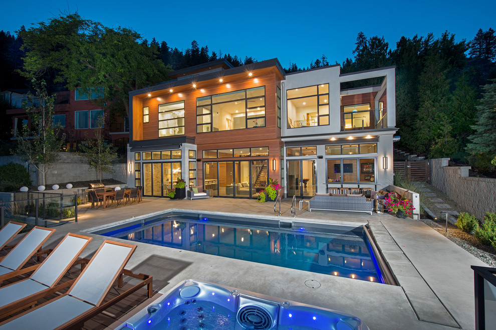 Contemporary two-storey house exterior in Vancouver with mixed siding and a flat roof.