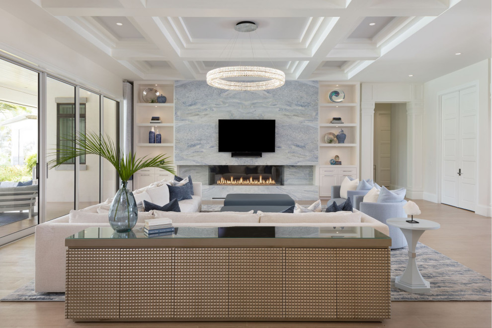 Photo of a large beach style open concept living room in Other with white walls, medium hardwood floors, a ribbon fireplace, a wall-mounted tv and coffered.