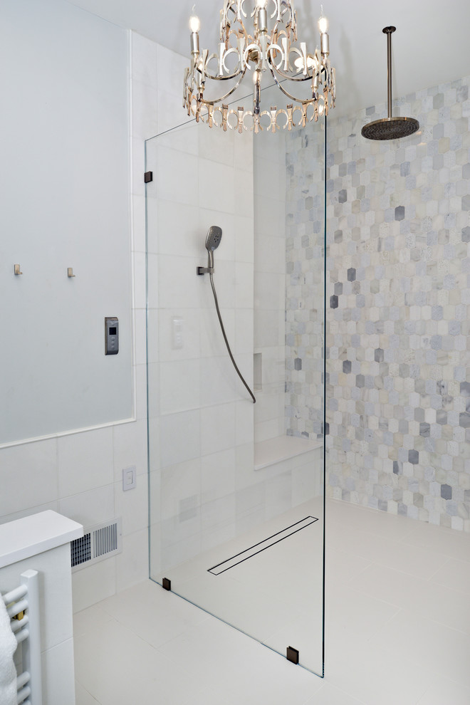 This is an example of a mid-sized modern master wet room bathroom in DC Metro with flat-panel cabinets, white cabinets, a freestanding tub, black and white tile, beige walls, an integrated sink, engineered quartz benchtops, white floor, an open shower and white benchtops.