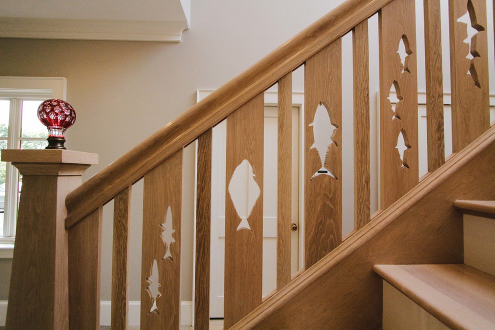 Design ideas for a mid-sized beach style wood straight staircase in Boston with wood risers and wood railing.