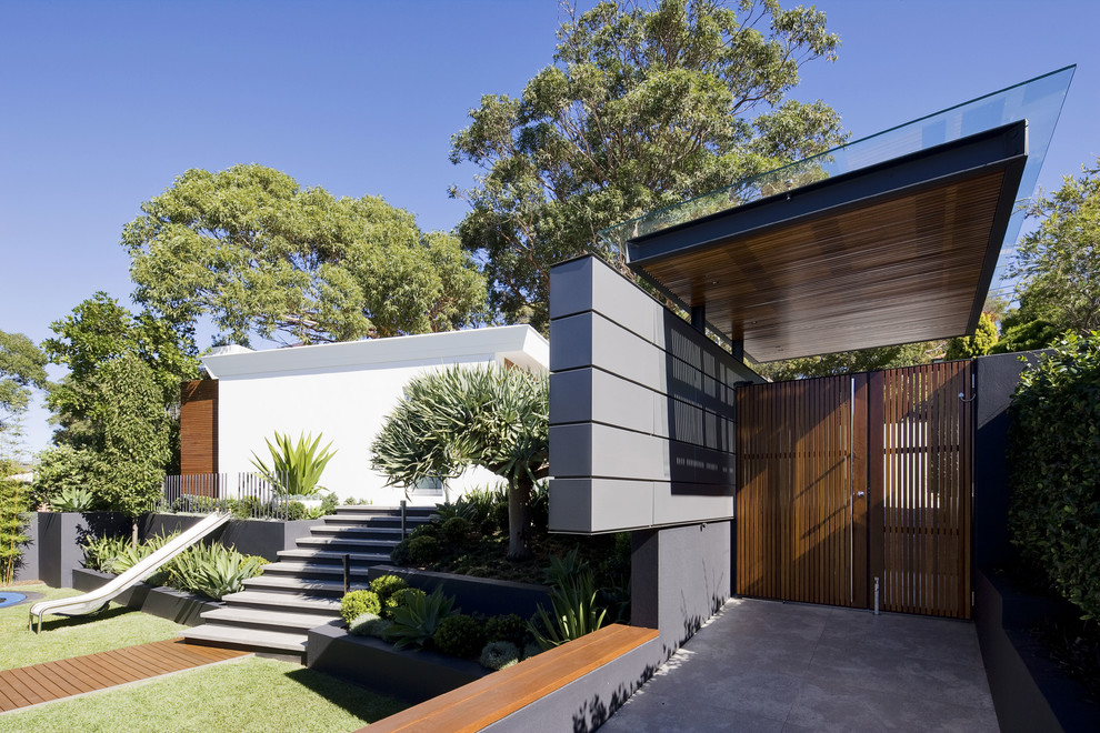 Design ideas for a contemporary stucco exterior in Sydney.