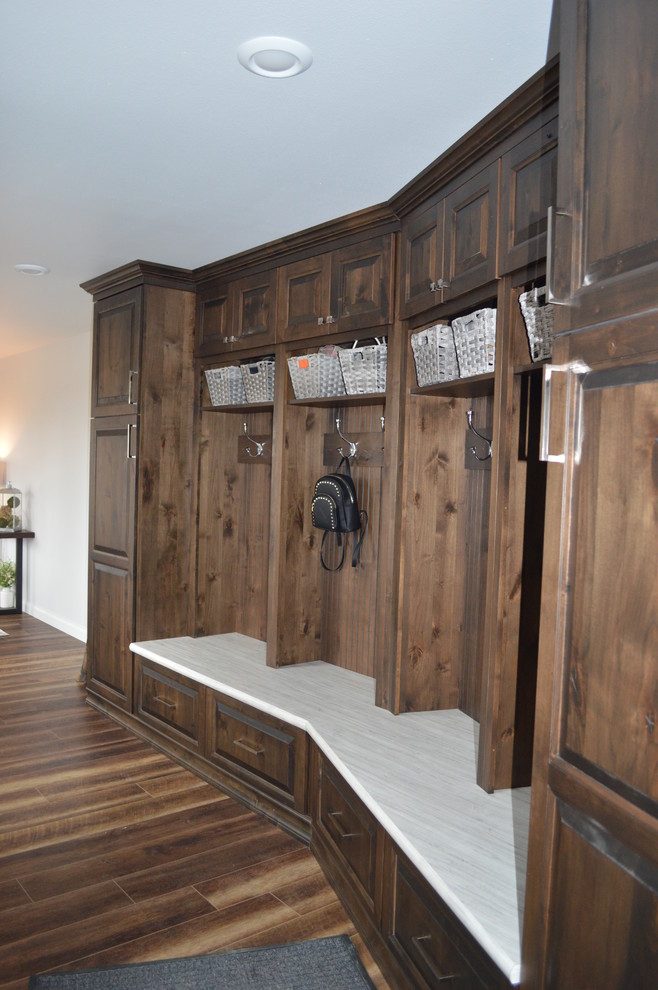 Example of a large transitional brown floor entry hall design