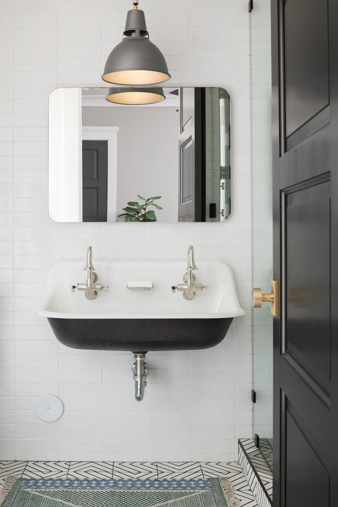 Doorless shower - mid-sized transitional kids' white tile and subway tile cement tile floor and white floor doorless shower idea in Phoenix with shaker cabinets, black cabinets, a one-piece toilet, white walls, a wall-mount sink, quartz countertops and a hinged shower door