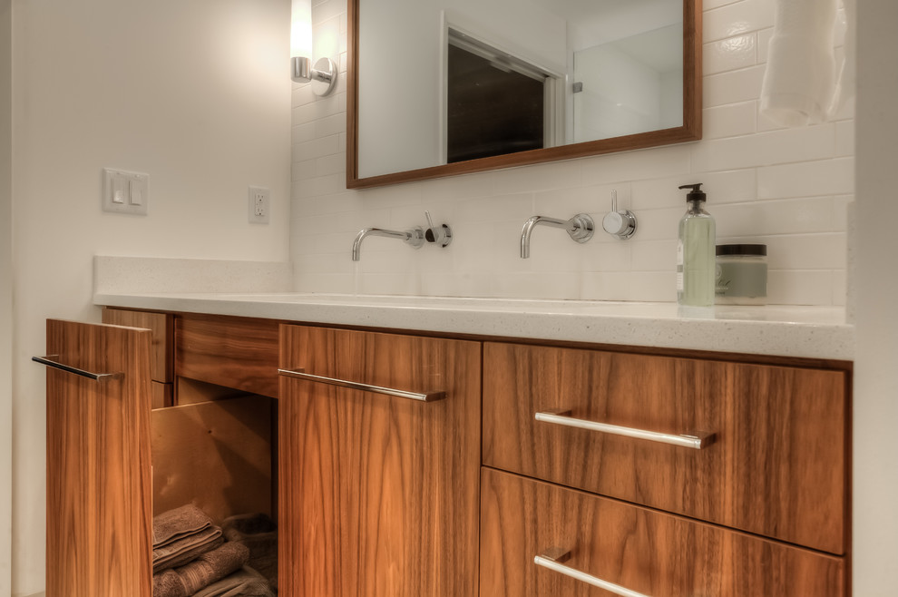 Inspiration for an expansive contemporary master bathroom in Portland with flat-panel cabinets, medium wood cabinets, an alcove tub, a curbless shower, a one-piece toilet, white tile, ceramic tile, white walls, porcelain floors, an undermount sink and engineered quartz benchtops.